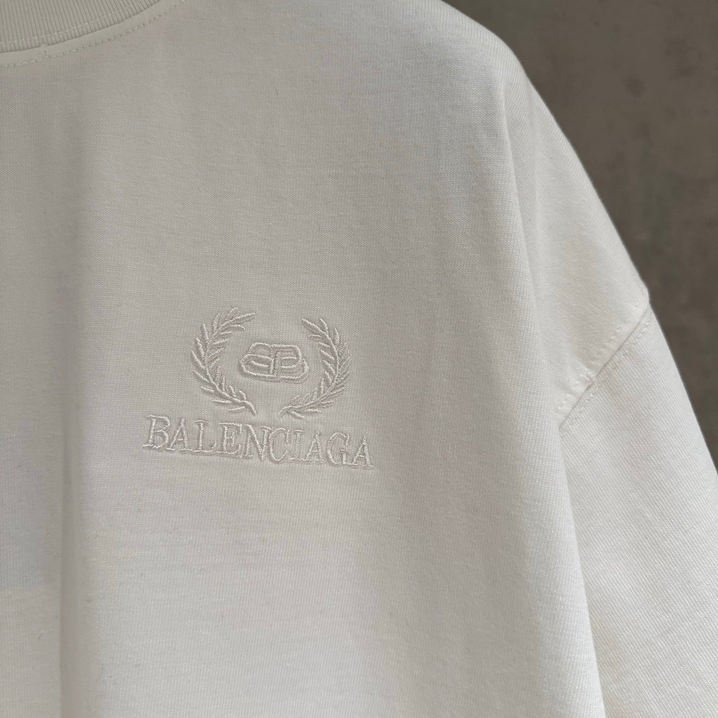 Balenciaga white T-shirt sleeve and chest logo detail, smooth jersey fabric