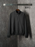 Gucci long jacket in dark fabric with allover GG pattern, front zipper, ribbed cuffs