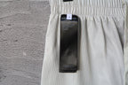 White pants with inner mesh fabric and size label tag near waistband