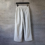 White wide-leg pants with elastic waistband, hanging display