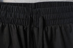 Black Balenciaga pants waistband with textured mesh panel below