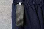 Balenciaga pants size and care label on dark navy fabric