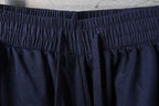 Balenciaga pants elastic waistband with gathered texture on dark navy fabric