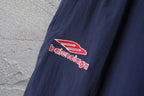 Balenciaga logo patch on navy pants leg