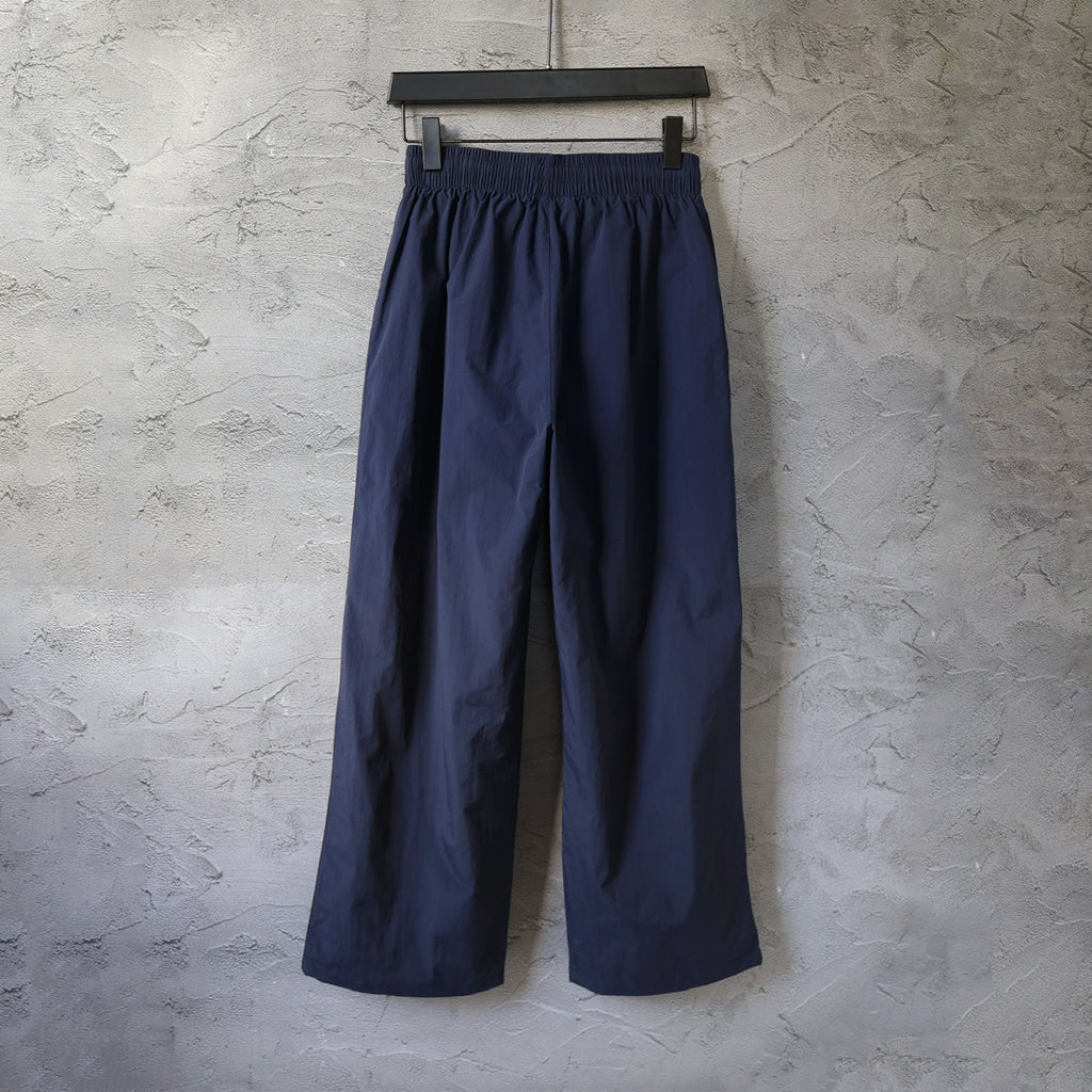 Navy wide-leg pants with elastic waistband and relaxed straight legs