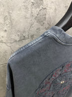 Dark blue denim short with curved waistband seam and side embroidery detail