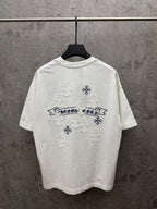 White short-sleeve T-shirt with large back graphic: blue banner text and snowflake appliques