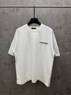 White short-sleeve T-shirt with small chest logo graphic in blue and white texture