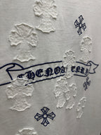 White short-sleeve T-shirt close-up of back banner text surrounded by raised snowflake patches