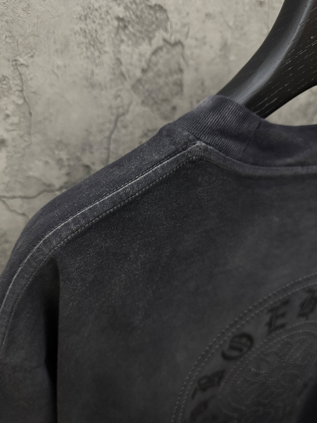 Dark gray T-shirt with crew neck seam and partial rhinestone back graphic