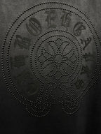 Dark gray T-shirt with large rhinestone skull face graphic, text accents