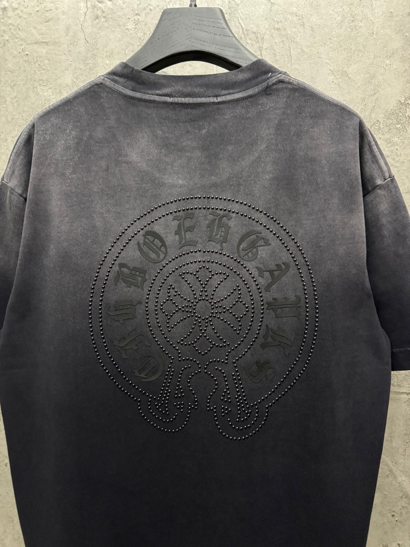 Dark gray short-sleeve T-shirt with large circular back rhinestone skull design