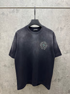 Dark short-sleeve T-shirt with small chest logo emblem on the left side