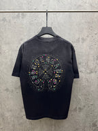 Dark short-sleeve T-shirt with large studded circular graphic on the back