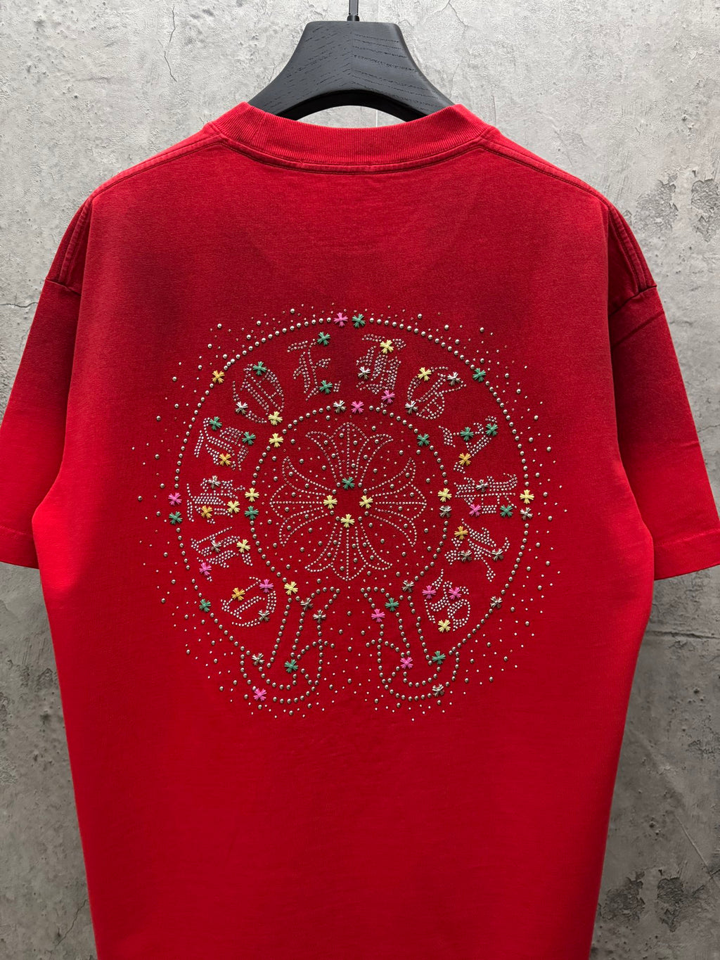 Red short-sleeve T-shirt with full circular rhinestone graphic on back