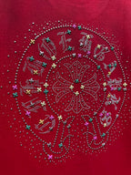 Red T-shirt with close-up of large circular rhinestone pattern and multicolor accents