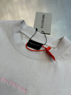 Light gray T-shirt collar with neck tag and red string pull detail