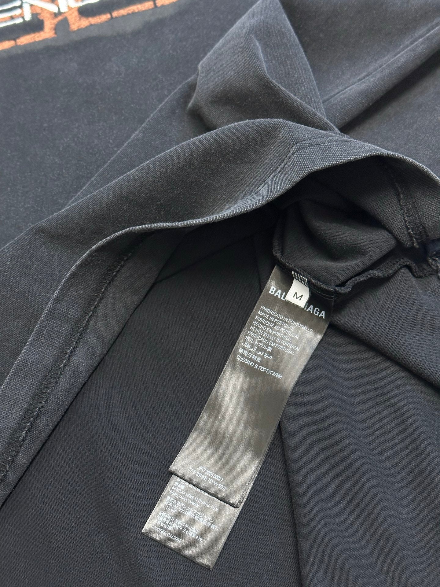 Balenciaga T-shirt interior collar with size labels and folded fabric in dark gray
