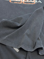 Dark gray Balenciaga T-shirt fabric close-up showing knit texture and sleeve hem