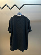 Back view of dark navy short-sleeve crewneck T-shirt with monogram texture
