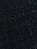 Dark textured monogram pattern fabric for a crewneck T-shirt