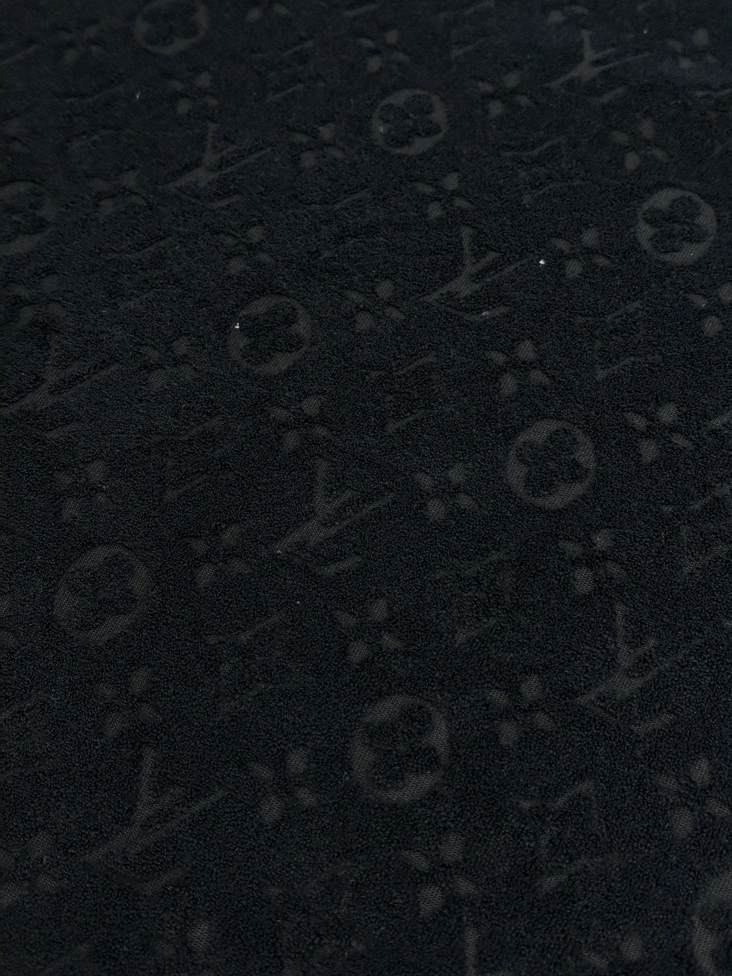 Dark textured monogram pattern fabric for a crewneck T-shirt
