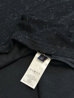 Dark monogram T-shirt fabric with sewn-in care label at hem