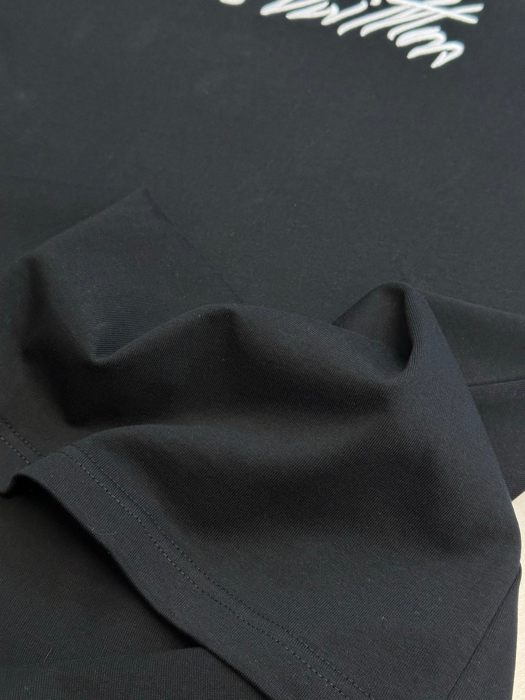 Louis Vuitton black T-shirt fabric panel with stitched edge detail