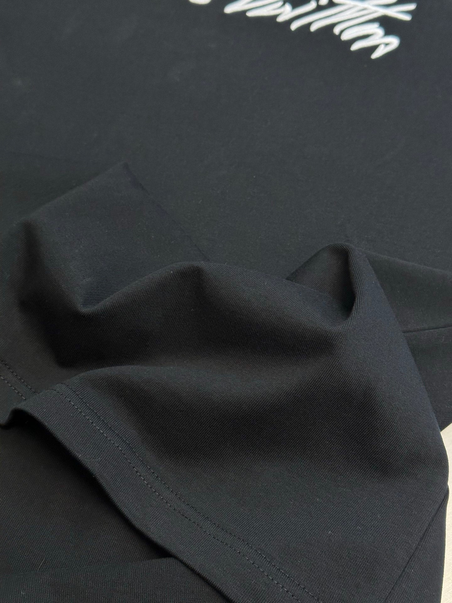 Louis Vuitton black T-shirt fabric panel with stitched edge detail