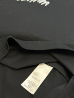 Louis Vuitton T-shirt inner care label on black collar