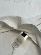 White T-shirt collar and interior neck label with hidden seam detail