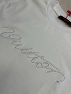 White T-shirt with Louis Vuitton signature-style embroidery across fabric