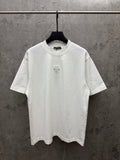 White short-sleeve T-shirt with small chest embroidered flower emblem