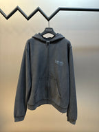 Dark gray zip hoodie with hood, front pouch pocket, and logo graphic