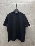 Black short-sleeve crewneck T-shirt with small floral cross emblem on chest
