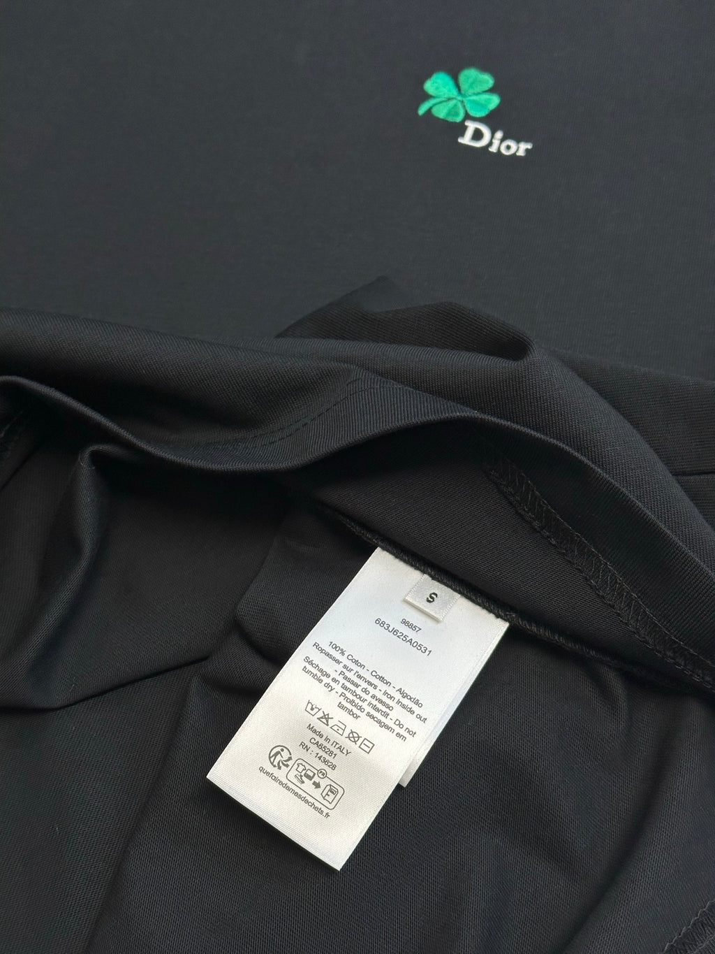 Dior black T-shirt fabric with garment label tag tucked into fold