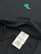 Dior black T-shirt fabric with garment label tag tucked into fold