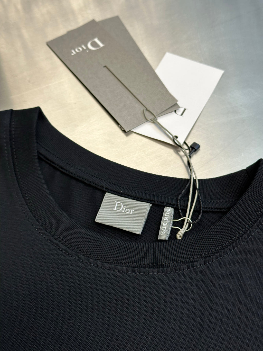 Dior black short-sleeve T-shirt neckline with inside tag and hanging label