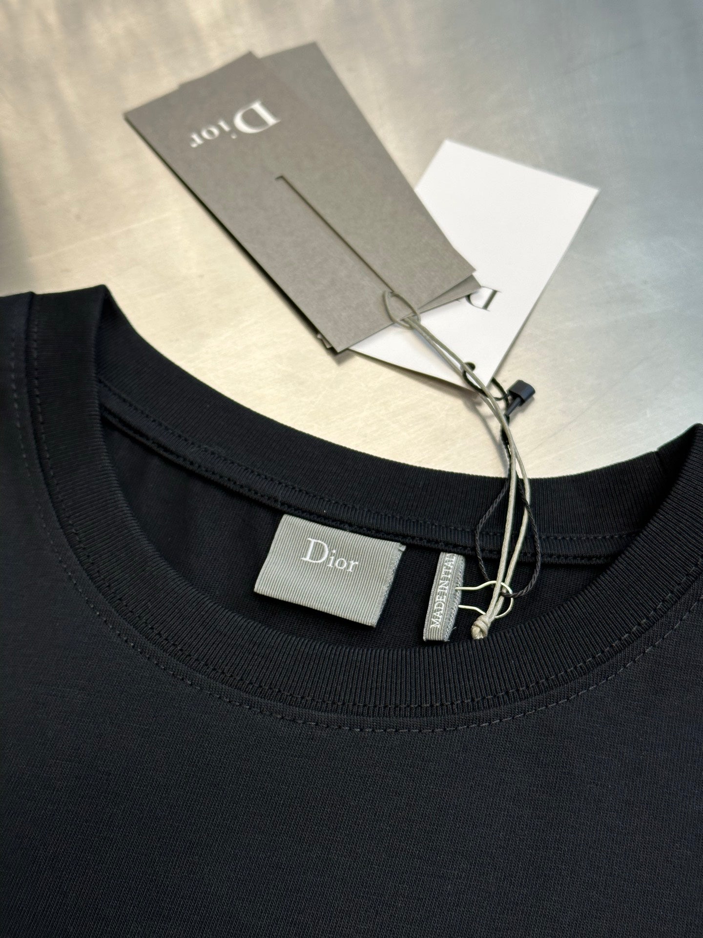 Dior black short-sleeve T-shirt neckline with inside tag and hanging label