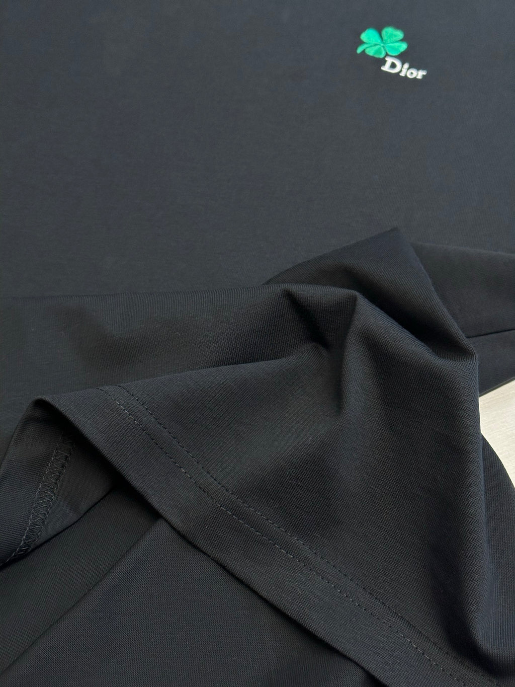 Dior black short-sleeve T-shirt fabric detail with stitched seam