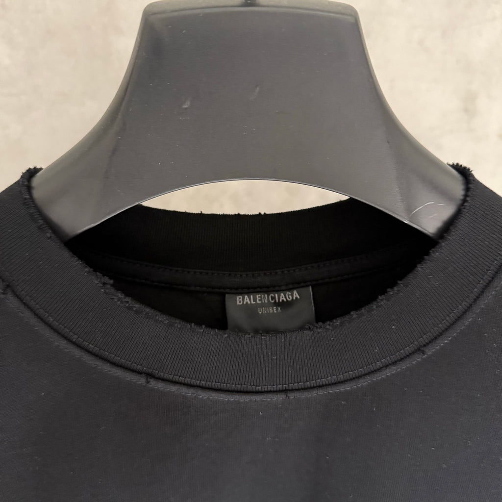 Black T-shirt neckline with inner brand label and ribbed collar