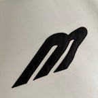 Black logo graphic on white T-shirt fabric