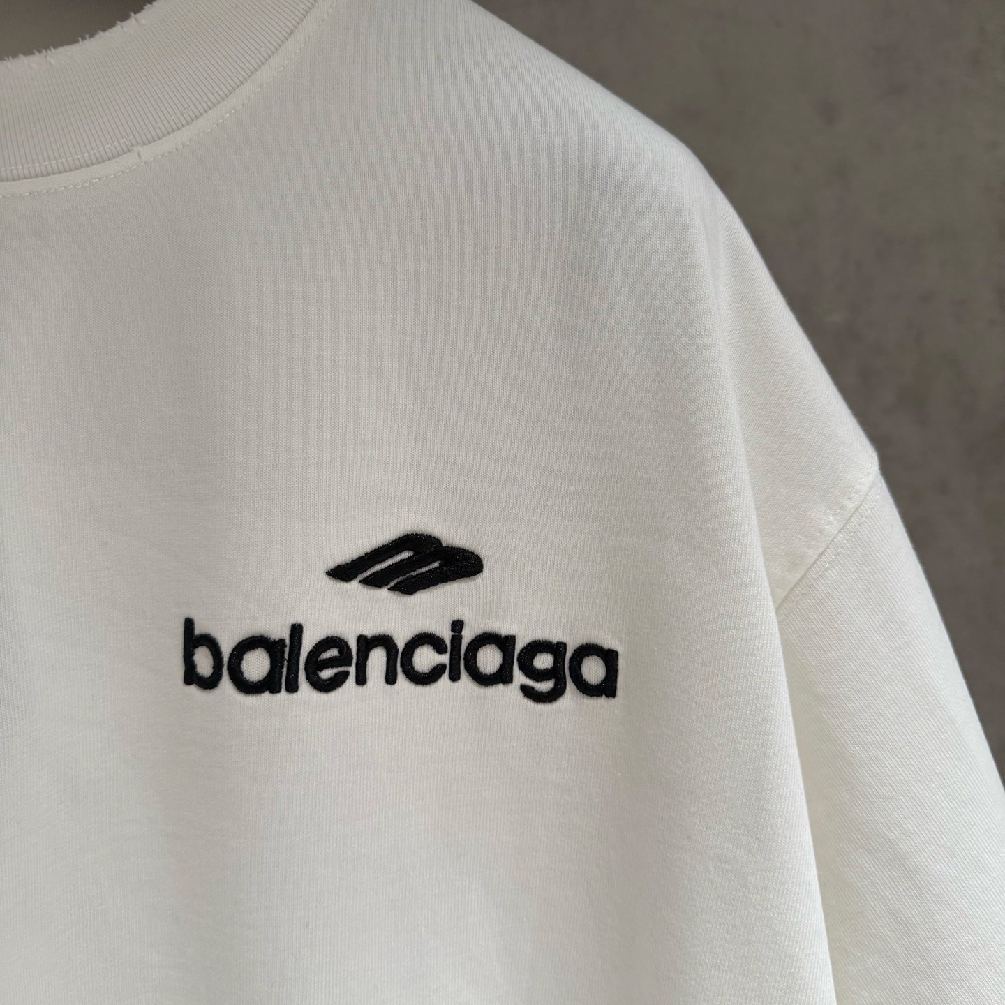 White crewneck T-shirt sleeve with Balenciaga logo