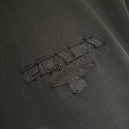 Embroidered Prada logo on black short-sleeve T-shirt front