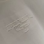White Prada logo embroidery on chest