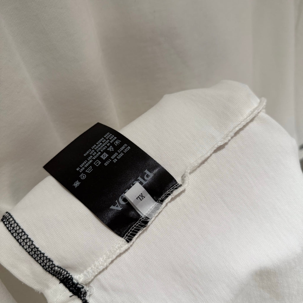 White Prada short-sleeve T-shirt with sleeve seam and care tag