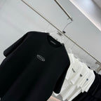 Black short-sleeve T-shirt with wang chest logo on hanger