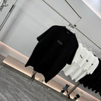 Black graphic T-shirt on hanger, short sleeves, wang logo