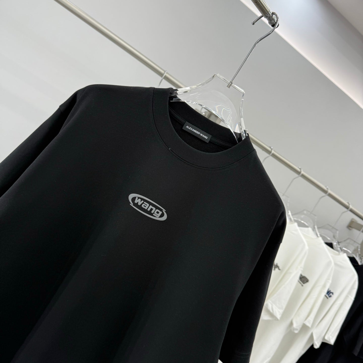 Black short-sleeve T-shirt with centered wang logo