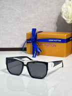 Louis Vuitton sunglasses with black frames and silver trim with dark tinted lenses